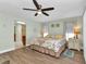 Relaxing main bedroom with en-suite bath, ceiling fan, and comfortable decor at 318 Spring Lake Nw Blvd, Port Charlotte, FL 33952