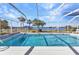 Refreshing swimming pool within a screened enclosure, offering views of the water and surrounding landscape at 318 Spring Lake Nw Blvd, Port Charlotte, FL 33952