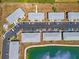 Overhead view of condo buildings with ample parking and a view of the community pond at 3310 Loveland Blvd # 1503, Punta Gorda, FL 33980