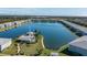 Breathtaking aerial view showcasing the lake, community pool and clubhouse amenities at 3310 Loveland Blvd # 1503, Punta Gorda, FL 33980
