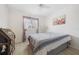 Well-lit bedroom with light wood-look floors, bright window and stylish furnishings at 3310 Loveland Blvd # 1503, Punta Gorda, FL 33980