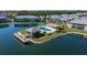 Stunning aerial view showcasing the community pool, cabana, and lakefront location at 3310 Loveland Blvd # 1503, Punta Gorda, FL 33980