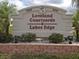 Loveland Courtyards Lakes Edge community sign featuring a welcoming entrance with professional landscaping at 3310 Loveland Blvd # 1503, Punta Gorda, FL 33980