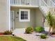 Condo exterior featuring lush landscaping, a well-lit entrance, and visible unit number at 3310 Loveland Blvd # 1503, Punta Gorda, FL 33980