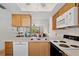 Bright kitchen featuring modern appliances, a breakfast bar, and an open layout concept at 3310 Loveland Blvd # 1503, Punta Gorda, FL 33980