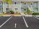 Designated parking spot for condo unit 1503, with beautifully maintained landscaping at 3310 Loveland Blvd # 1503, Punta Gorda, FL 33980