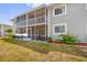 Screened lanai of a condo unit with lawn and exterior views, promoting relaxation at 3310 Loveland Blvd # 1503, Punta Gorda, FL 33980