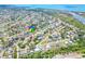 A beautiful aerial view of a waterfront neighborhood featuring lush greenery and easy access to stunning water views at 3319 Shamrock Dr, Venice, FL 34293