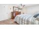 Bedroom features a dresser, ceiling fan, closet, and a flat screen TV at 3319 Shamrock Dr, Venice, FL 34293