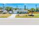 Charming single-story home with a well-manicured lawn, a one-car garage, and a freshly sealed driveway at 3319 Shamrock Dr, Venice, FL 34293