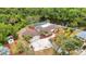 Beautiful aerial view of home showcasing a screened-in pool and private river access at 3400 Allapatchee Dr, Punta Gorda, FL 33950