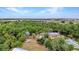 Picturesque aerial view of waterfront home, boats, and lush greenery at 3400 Allapatchee Dr, Punta Gorda, FL 33950