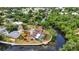 Scenic aerial view showcases a beautiful home on the water with a screened lanai and a private dock at 3400 Allapatchee Dr, Punta Gorda, FL 33950