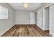 Bedroom features wood floors, a ceiling fan, and a double-door closet at 3400 Allapatchee Dr, Punta Gorda, FL 33950