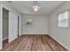 Bedroom features wood floors, ceiling fan, window and closet at 3400 Allapatchee Dr, Punta Gorda, FL 33950