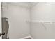 Walk-in closet with wire shelving and water heater at 3400 Allapatchee Dr, Punta Gorda, FL 33950
