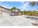 Home featuring meticulous landscaping and a winding driveway, offers curb appeal and a welcoming entrance at 3400 Allapatchee Dr, Punta Gorda, FL 33950