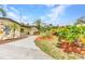Well-maintained home with landscaped gardens, stone facade, and manicured lawn, offers curb appeal and a welcoming ambiance at 3400 Allapatchee Dr, Punta Gorda, FL 33950