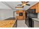 Kitchen view showcasing wooden cabinets, an island, stainless steel appliances and modern finishes at 3400 Allapatchee Dr, Punta Gorda, FL 33950