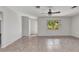Open living room space with neutral walls, tile flooring, and a view to the outside at 3400 Allapatchee Dr, Punta Gorda, FL 33950