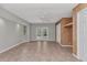 Open living room with tile floor, ceiling fan, and glass doors leading to the outdoor area at 3400 Allapatchee Dr, Punta Gorda, FL 33950