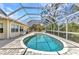 Beautiful screened pool area with large pool, brick pavers, and ample space for outdoor entertaining at 3400 Allapatchee Dr, Punta Gorda, FL 33950