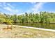 Beautiful view of the serene canal with lush greenery, perfect for enjoying peaceful waterfront living at 3400 Allapatchee Dr, Punta Gorda, FL 33950