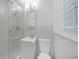 The bathroom features updated tiling, glass shower doors, a modern sink, and shuttered window at 3515 Vasco St, Punta Gorda, FL 33950