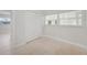 A light, bright bedroom with two windows is well-lit, with tile floors and a closet at 3515 Vasco St, Punta Gorda, FL 33950