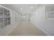 Bright bonus room with neutral tile flooring, recessed lighting, and multiple windows at 3515 Vasco St, Punta Gorda, FL 33950