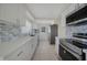 Modern kitchen featuring stainless steel appliances and stylish backsplash at 3515 Vasco St, Punta Gorda, FL 33950