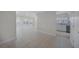 Open-concept living area with large windows and access to the modern kitchen at 3515 Vasco St, Punta Gorda, FL 33950