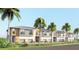 Modern townhome exterior featuring a two-story design, private garage, and tropical landscaping with palm trees at 3609 Bal Harbor Blvd, Punta Gorda, FL 33950