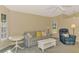 Bright living room featuring a cozy sofa, recliner, and lots of natural light at 4098 Fairway Pl, North Port, FL 34287