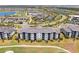 Aerial view of the condo building showcasing the community's amenities and landscaping at 43050 Greenway Blvd # 645, Punta Gorda, FL 33982