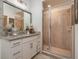 Bathroom features a granite countertop, white cabinets and tiled shower at 43050 Greenway Blvd # 645, Punta Gorda, FL 33982