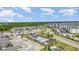 Aerial view featuring a community pool, residential buildings, and well-maintained streets at 43050 Greenway Blvd # 645, Punta Gorda, FL 33982