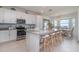 Modern kitchen with granite countertops, stainless steel appliances, and comfortable seating at 43050 Greenway Blvd # 645, Punta Gorda, FL 33982