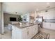 Open concept kitchen with granite countertops and stainless steel appliances flows into the living room at 43050 Greenway Blvd # 645, Punta Gorda, FL 33982