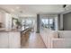 Spacious living area with kitchen and dining views, showcasing a modern and inviting space at 43050 Greenway Blvd # 645, Punta Gorda, FL 33982