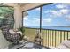 Relaxing patio with comfortable seating offers stunning views of the lake and golf course at 43050 Greenway Blvd # 645, Punta Gorda, FL 33982