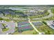 Aerial view of community pickleball and tennis courts with lush landscaping at 43050 Greenway Blvd # 645, Punta Gorda, FL 33982