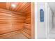 Interior view of a cedar-lined sauna room with multi-tiered benches at 43050 Greenway Blvd # 645, Punta Gorda, FL 33982