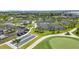 Tennis courts and bocce ball court with parking, surrounded by lush landscaping and palms trees at 43050 Greenway Blvd # 645, Punta Gorda, FL 33982