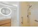 Bathroom featuring modern fixtures, an LED mirror, and a shower at 48 Hibiscus Dr, Punta Gorda, FL 33950