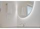 Modern bathroom with contemporary sink and faucet, towels and backlit mirror at 48 Hibiscus Dr, Punta Gorda, FL 33950