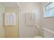This bathroom features neutral tile, clean white towels, and functional fixtures at 48 Hibiscus Dr, Punta Gorda, FL 33950