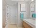 Bathroom with a white vanity, framed flamingo art, a tub, and a flamingo-themed shower curtain at 48 Hibiscus Dr, Punta Gorda, FL 33950