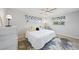 Cozy bedroom with a comfortable bed, decorative pillows, and stylish window curtains at 48 Hibiscus Dr, Punta Gorda, FL 33950