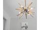 Unique starburst chandelier in a modern dining room at 48 Hibiscus Dr, Punta Gorda, FL 33950